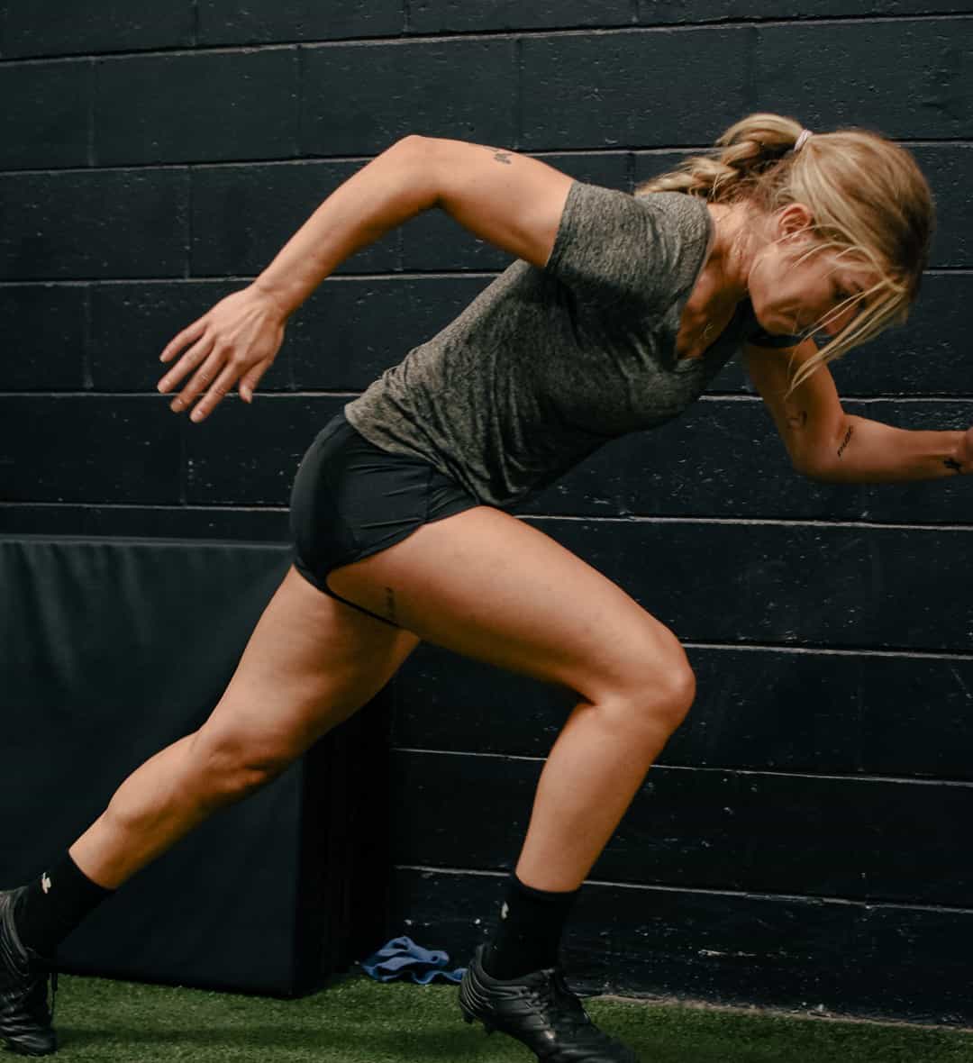 An adult sprinting at CANAM