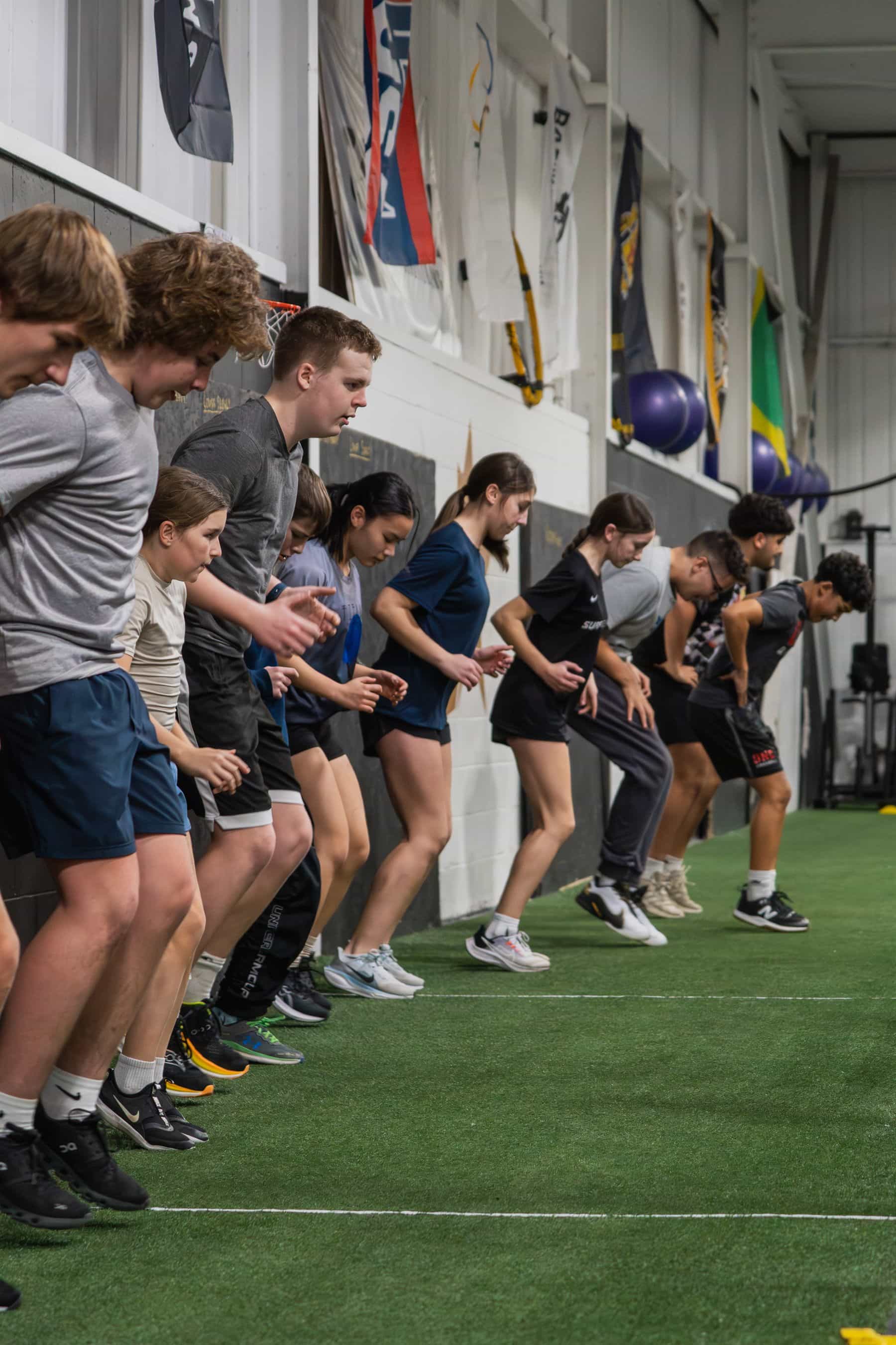Athletes lined up on the CANAM turf